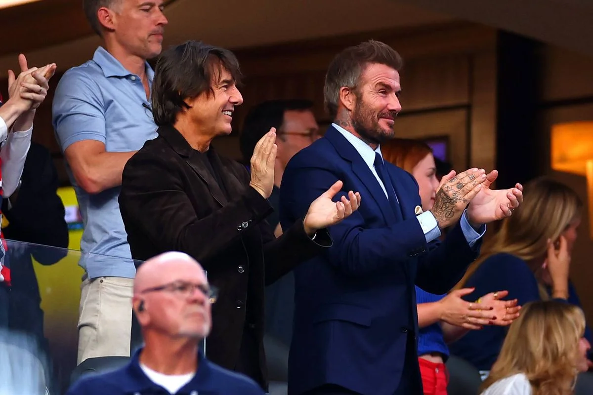 INGLEWOOD, CALIFORNIA - JUNE 12: Tom Cruise (L) and David Beckham applaud during the FIFA World Cup 2026 Group D match between USA and Paraguay at Los Angeles Stadium on June 12, 2026 in Inglewood, California. (Photo by Chris Brunskill/Fantasista/Getty Images)