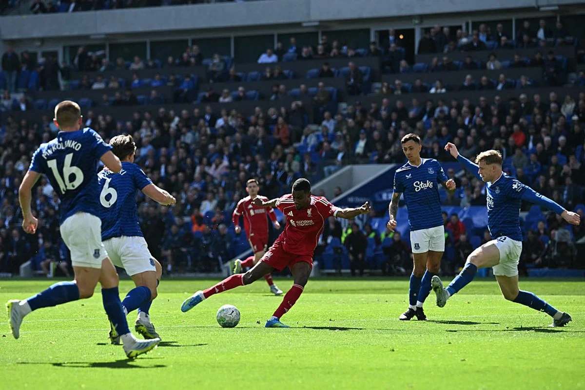 Liverpool will face Champions League games immediately before both Merseyside derbies (Photo by Paul ELLIS / AFP via Getty Images)