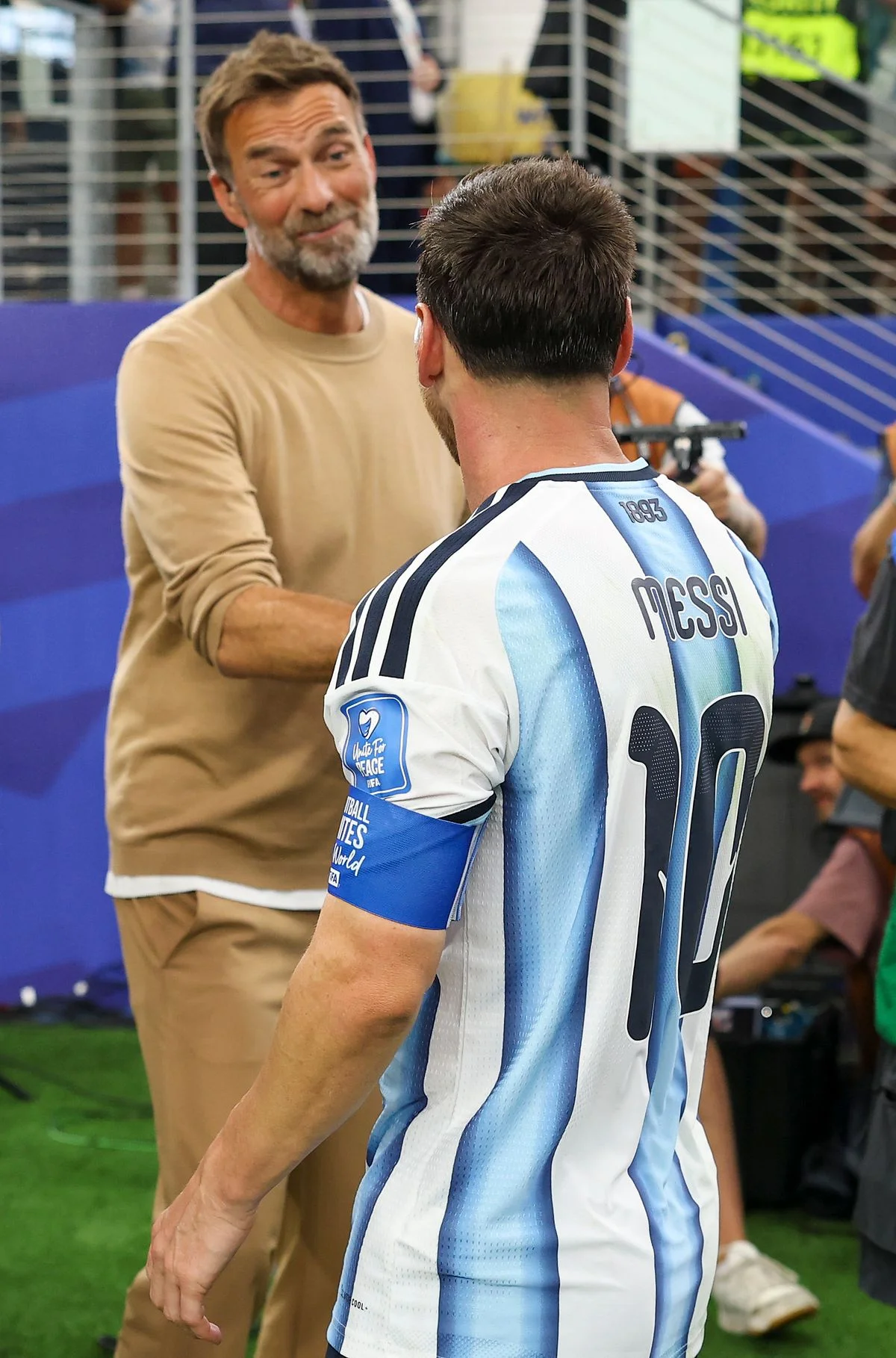 Jurgen Klopp and Lionel Messi shake hands after the World Cup game between Argentina and Austria in Dallas.